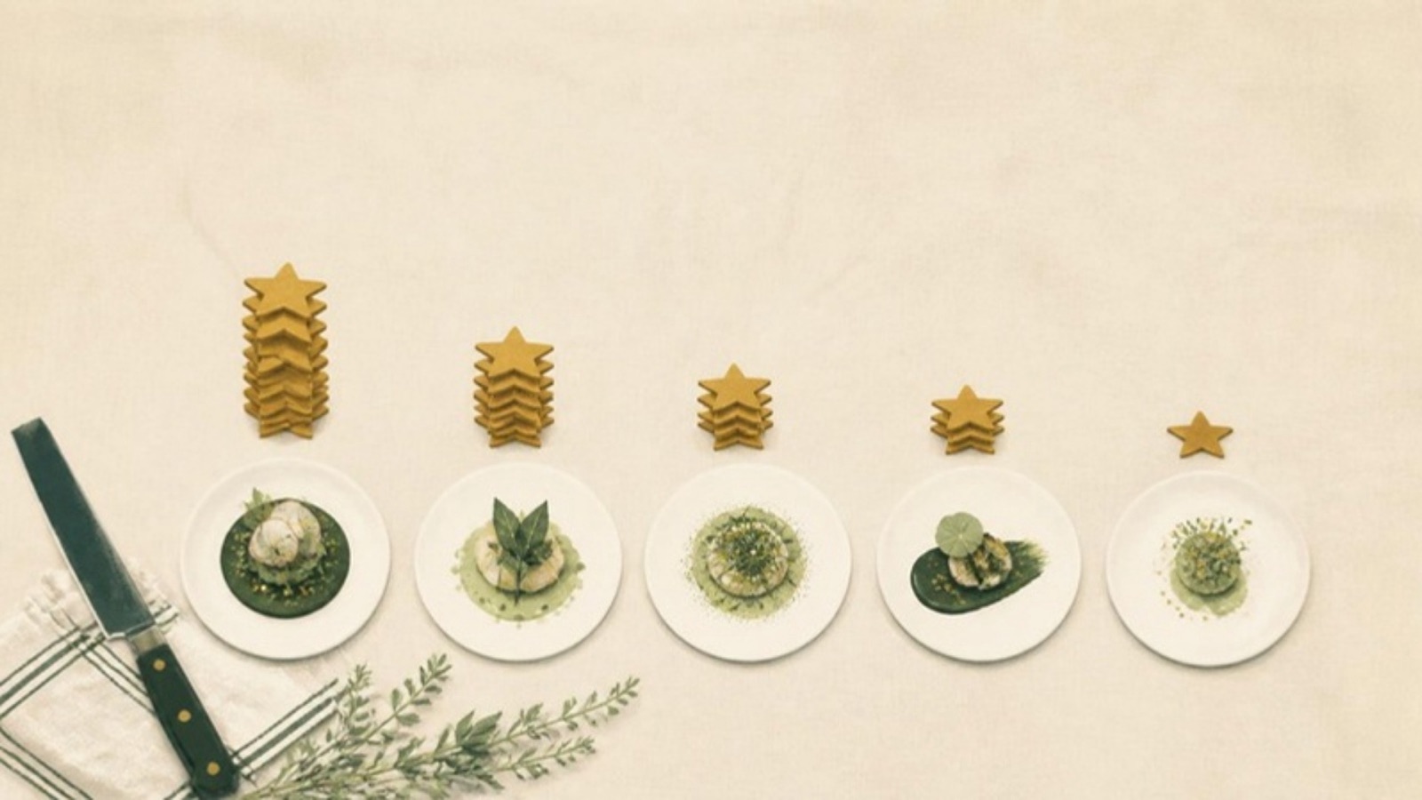 Illustration of five plated tasting-menu courses in a row on a cream tablecloth, each with a stack of gold stars behind it, tallest on the left.