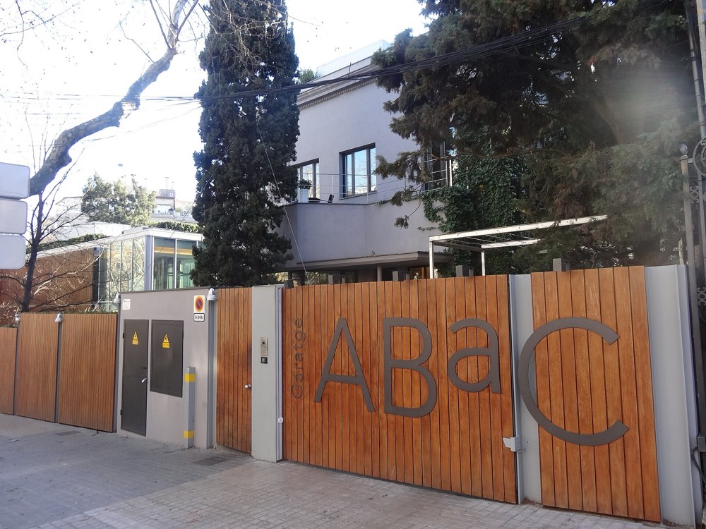 The wooden gates of ABaC with its name on Avinguda del Tibidabo, Barcelona