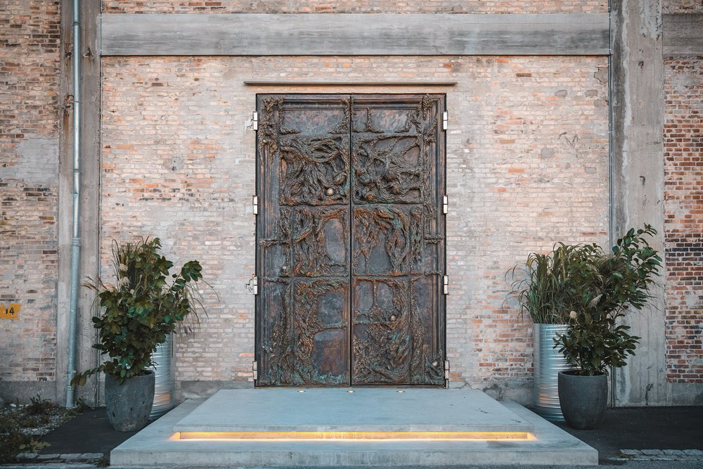 The large bronze entrance doors of Alchemist on Refshaleøen, Copenhagen