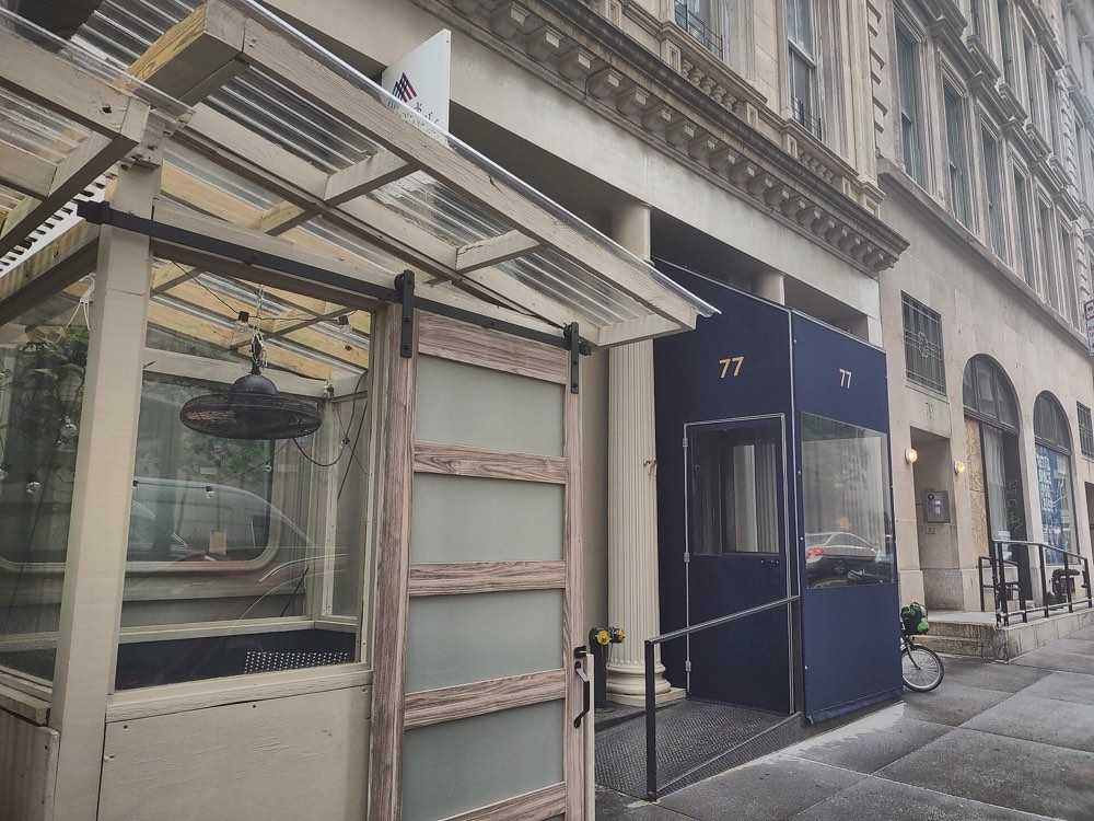 The blue entrance of Atera at 77 Worth Street, Tribeca, New York