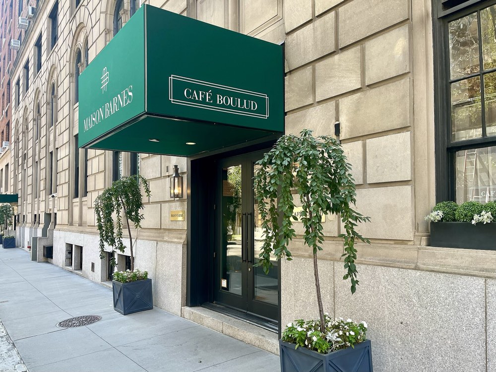 The green Café Boulud awning over its entrance at 100 East 63rd Street, New York