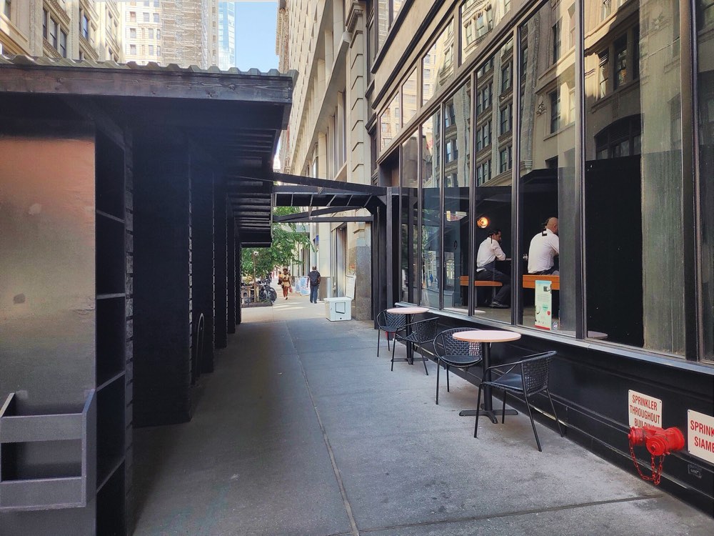 The sidewalk outside Cote on West 22nd Street, New York, with its outdoor dining shed