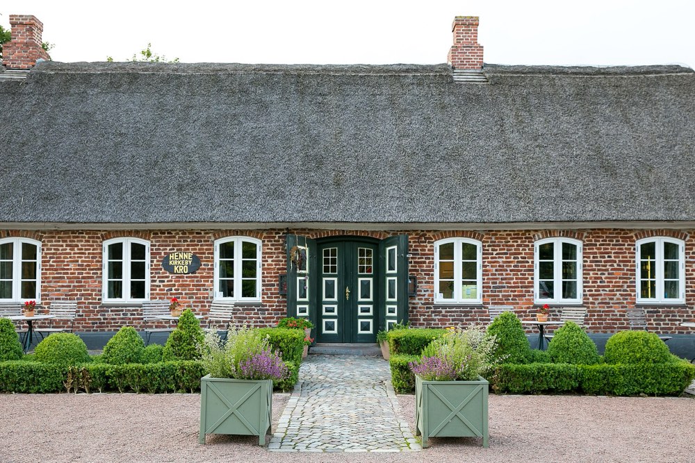The thatched front and entrance of Henne Kirkeby Kro in Henne, Denmark