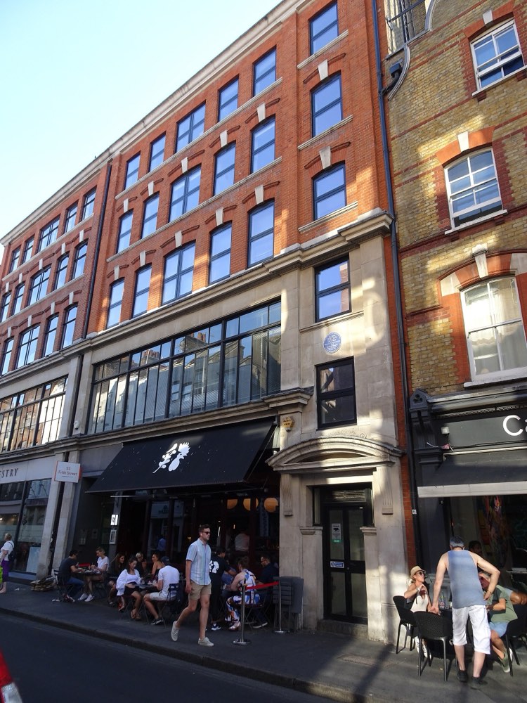 54 Frith Street in Soho, London, with Humble Chicken's black awning at street level