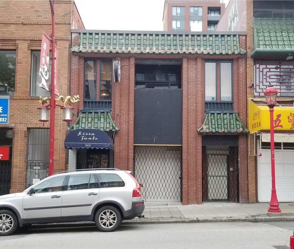 Kissa Tanto's red brick front and named awning in Chinatown, Vancouver