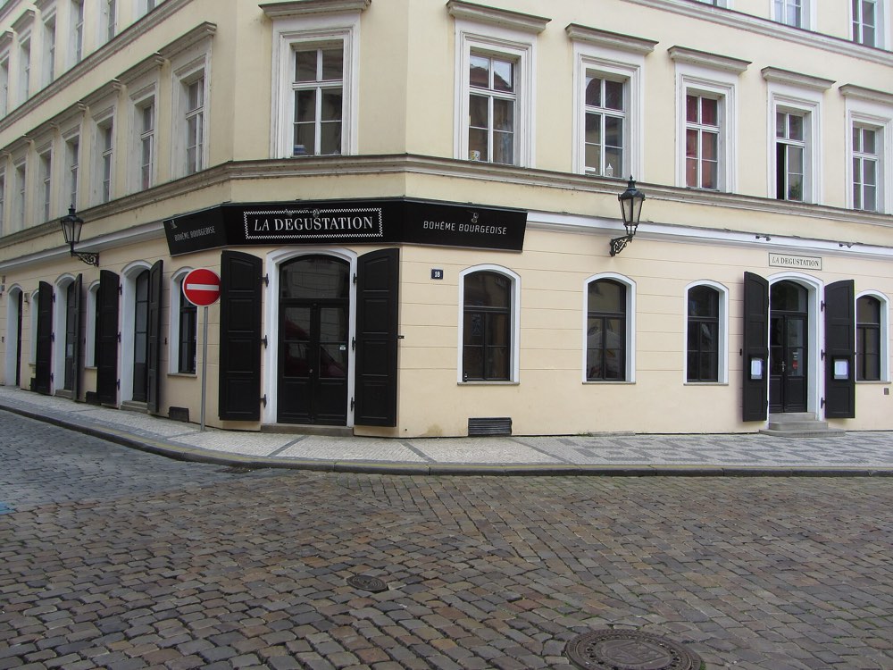 The corner front of La Degustation Bohême Bourgeoise on Haštalská, Prague