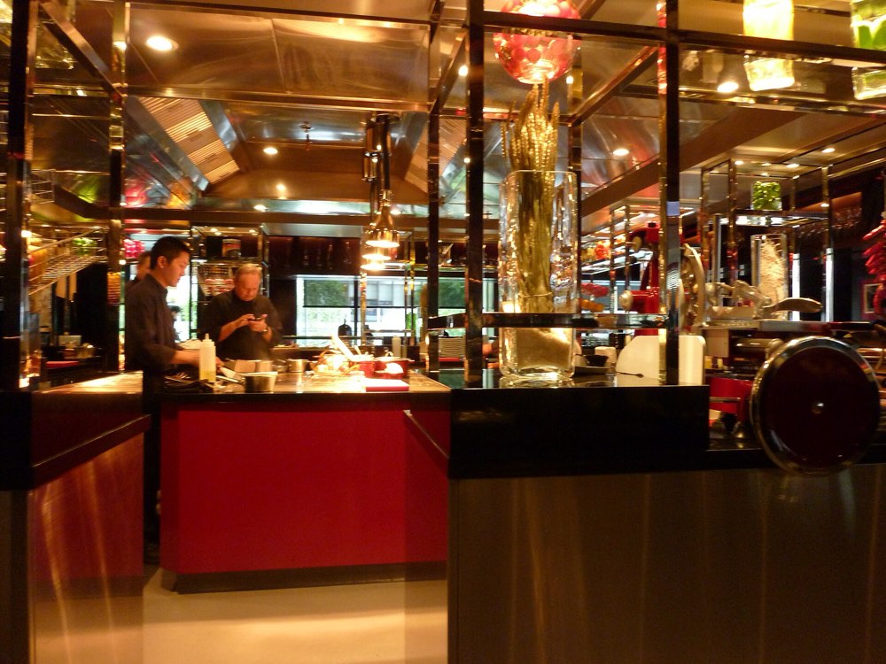 The red open kitchen counter of L'Atelier de Joël Robuchon in Hong Kong