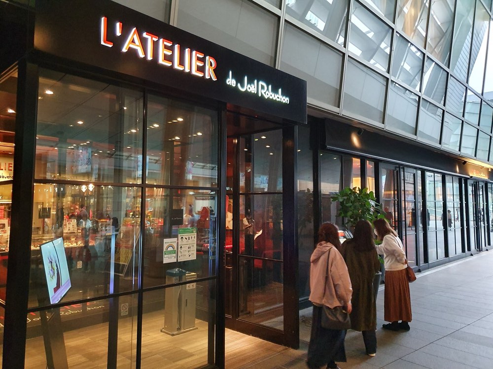 The L'Atelier de Joël Robuchon sign and glass entrance at Roppongi Hills, Tokyo