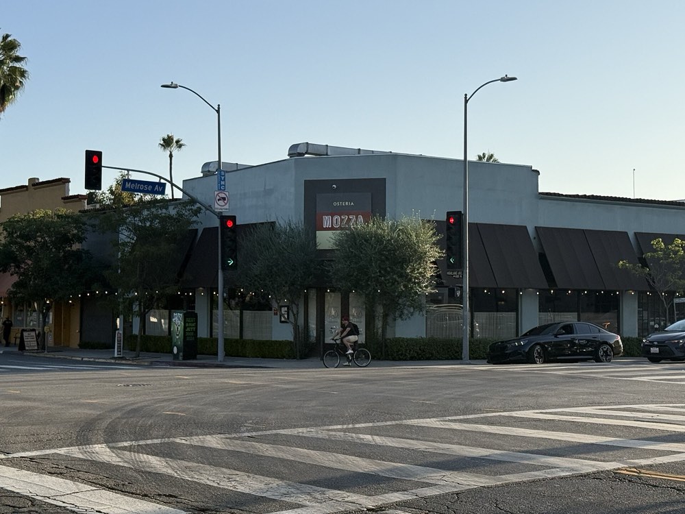The exterior of Osteria Mozza with its Mozza sign on Melrose Avenue, Los Angeles