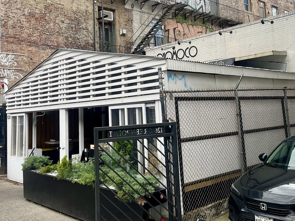 The white front and Oxomoco sign at 128 Greenpoint Avenue, Brooklyn