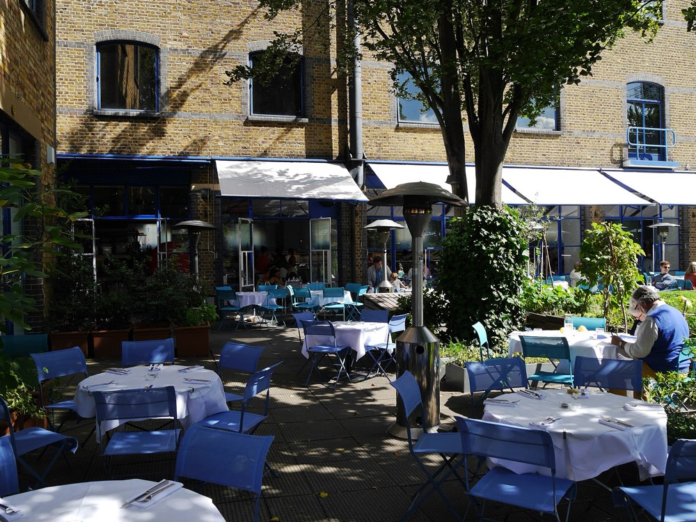 The riverside terrace of the River Café at Thames Wharf, Hammersmith