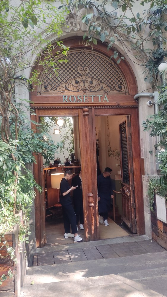 The arched doorway of Rosetta in Roma Norte, Mexico City, with its name above