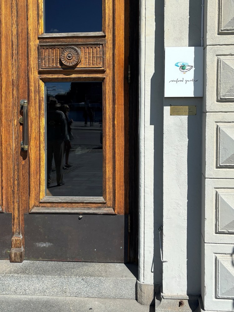 The door of Seafood Gastro in Stockholm, with the restaurant's sign beside it