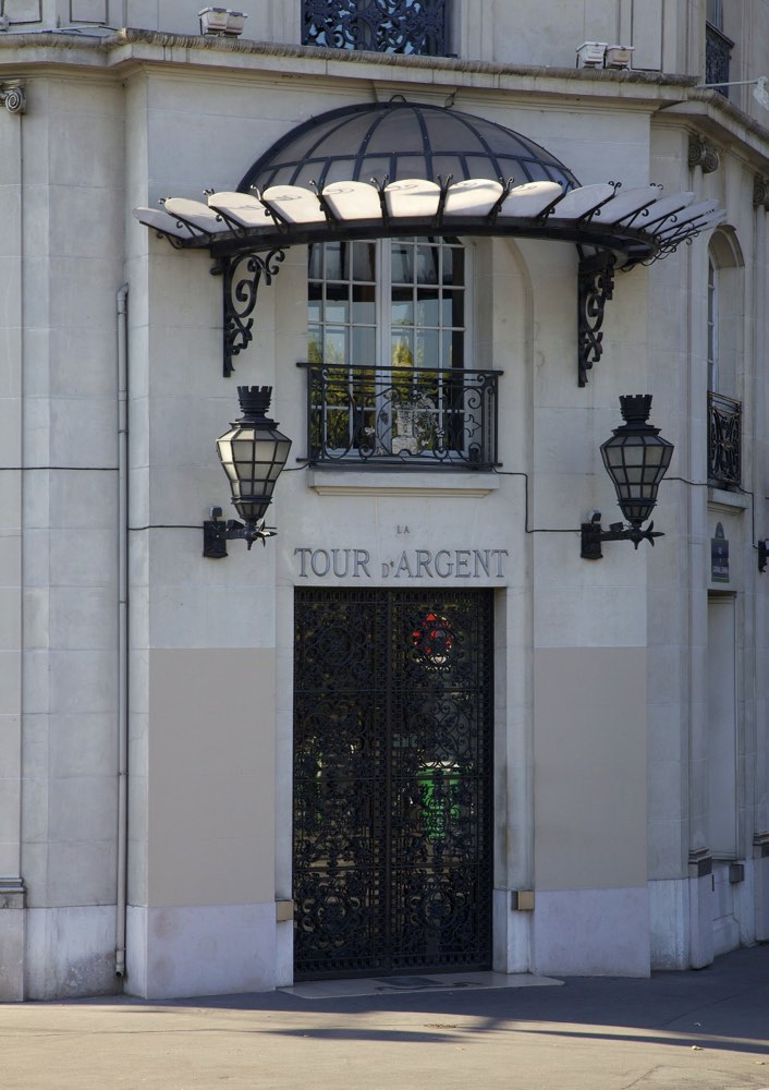 The entrance of La Tour d'Argent with its name above the door, Paris
