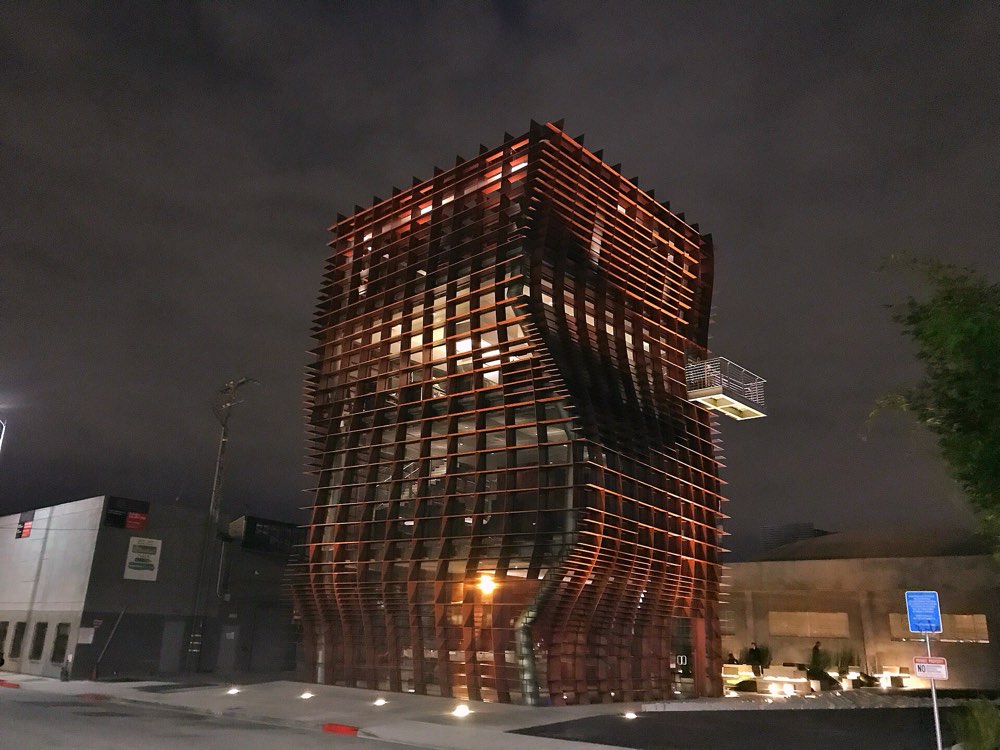 The red slatted Vespertine building lit up at night in Culver City, Los Angeles